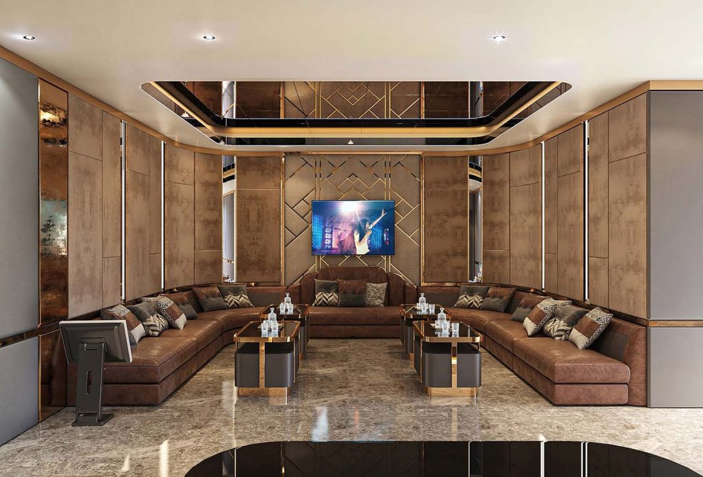 Thiết kế nội thất phòng karaoke VIP với ghế sofa chữ U da nâu và hệ thống gương trần nghệ thuật.